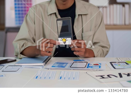 Creative Professional Presenting Mobile App Concept with Lightbulb Idea. 133414780