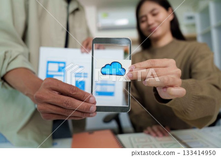 Cloud Technology in UI UX Design. Team showcasing mobile app features. 133414950