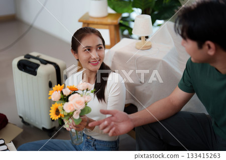 New Beginnings: Young Couple Unpacking and Decorating Their New Home 133415263