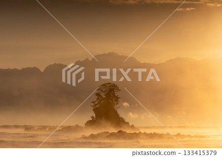 Onnaiwa Rock bathed in the light of the morning sun 133415379