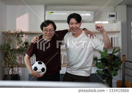 Celebrating soccer victory with father and son Celebrating soccer victory with father and son 133415668