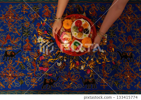 Elegant Puja Thali with Flowers and Diya for Rituals 133415774