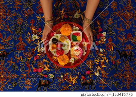 Traditional Indian Puja Thali with Flowers and Offerings 133415776