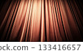 Stage curtain with warm spotlight gradient lighting 133416657