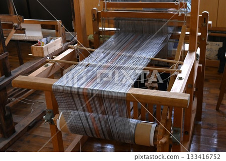 A scene from Tsumugi weaving, a traditional Japanese craft A scene from Tsumugi weaving, a traditional Japanese craft 133416752