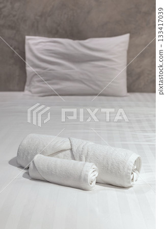 stack of white towel on bedroom stack of white towel on bedroom 133417039