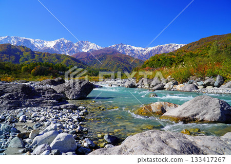Three-tiered autumn leaves seen from Hakuba Village in autumn Three-tiered autumn leaves seen from Hakuba Village in autumn 133417267