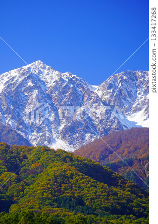 Three-tiered autumn leaves seen from Hakuba Village in autumn Three-tiered autumn leaves seen from Hakuba Village in autumn 133417268