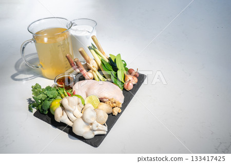 Close up to ingredients set of thai food, Coconut milk with chicken soup.The ingredients are chicken vegetable and many types of herbs toghether combine as a great dish. Close up to ingredients set of thai food, Coconut milk with chicken soup.The ingredients are chicken vegetable and many types of herbs toghether combine as a great dish. 133417425