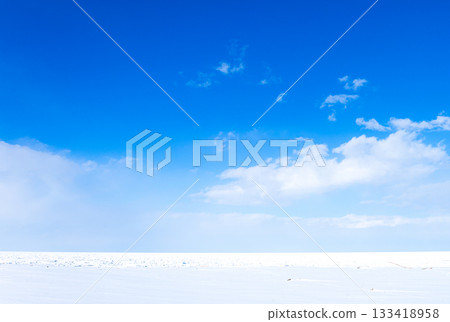 A sheet of drift ice ashore on the Sea of Okhotsk in Hokkaido in mid-winter under a clear blue sky A sheet of drift ice ashore on the Sea of Okhotsk in Hokkaido in mid-winter under a clear blue sky 133418958