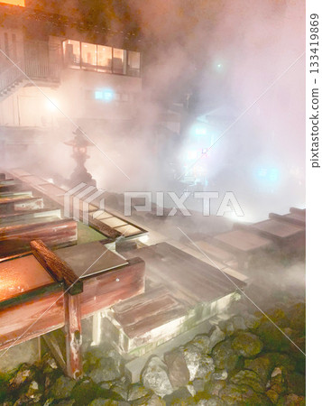 Hot spring with Yubatake flowing at night 133419869