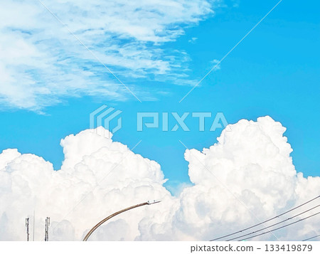 Summer blue sky, cumulonimbus clouds and contrails 133419879