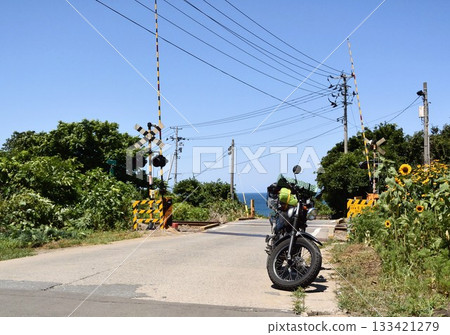 Motorcycle and railroad crossing Motorcycle and railroad crossing 133421279