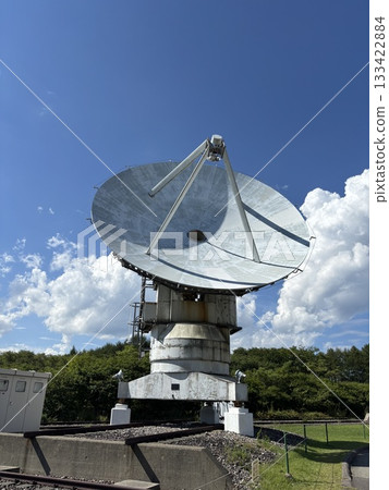 "Large parabolic antenna towering into the blue sky | Space communications and satellite communications equipment" "Large parabolic antenna towering into the blue sky | Space communications and satellite communications equipment" 133422884