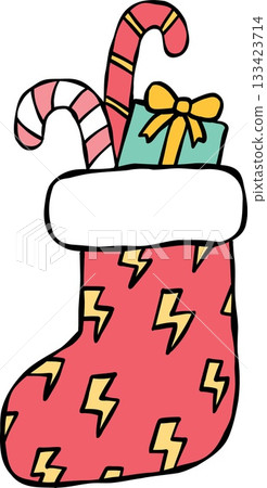 christmas Colorful Christmas stocking filled with candy canes and a gift. christmas Colorful Christmas stocking filled with candy canes and a gift. 133423714