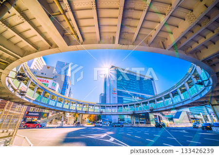 Yokohama cityscape in Japan. View of Yokohama Station, the north exit of JR Shin-Yokohama Station, and the circular footbridge over Yokohama Loop Line 2. A ray of hope. 133426239