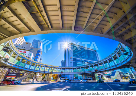 Yokohama cityscape in Japan. View of Yokohama Station, the north exit of JR Shin-Yokohama Station, and the circular footbridge over Yokohama Loop Line 2. A ray of hope. 133426240