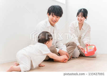 Parents and children playing with their babies in the living room, family, couple 133427091