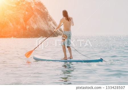 Man Paddleboarding Sunset Ocean Beach Man Paddleboarding Sunset Ocean Beach 133428507