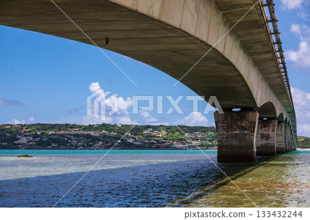 The Kouri Bridge in Okinawa spans the blue sea, connecting Kouri Island. 133432244