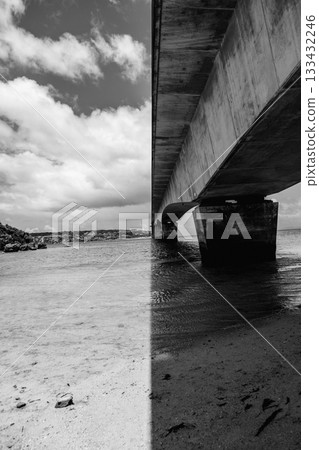 The Kouri Bridge in Okinawa spans the blue sea, connecting Kouri Island. 133432246