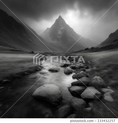 Dramatic black and white mountain landscape with rocky stream 133432257