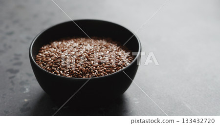 flaxseed in black bowl on terrazzo countertop with copy space flaxseed in black bowl on terrazzo countertop with copy space 133432720