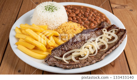 The image shows Bife Acebolado, a classic Brazilian dish consisting of steak and onions 133433140