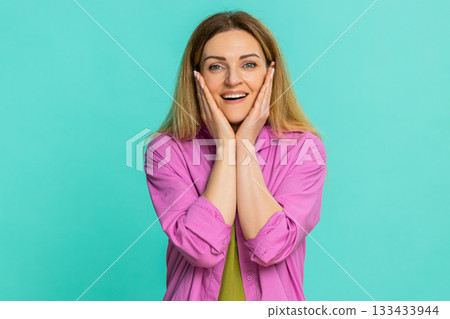 Adult woman covering face with hands expressing shock surprise emotional reaction to unexpected news Adult woman covering face with hands expressing shock surprise emotional reaction to unexpected news 133433944