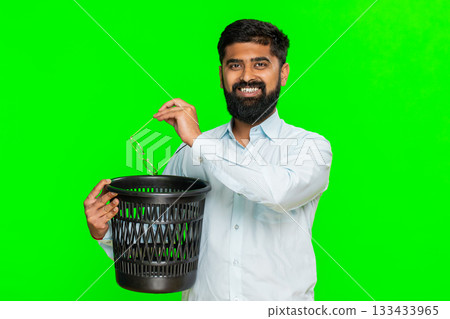 Indian man smiling removing glasses and tossing them away showing eye correction vision freedom 133433965