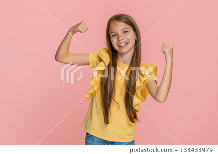 Child girl kid showing victory win gesture while happily and joyfully celebrating success with smile Child girl kid showing victory win gesture while happily and joyfully celebrating success with smile 133433979