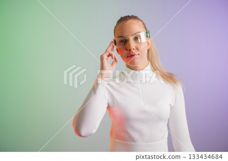 Woman in futuristic eyeglasses posing 133434684