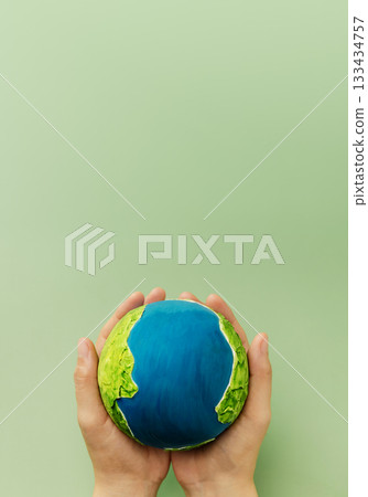 Earth in hands symbolizing sustainability, global environmental care 133434757
