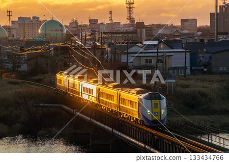 The Ozora Express train reflecting the sunrise 133434766