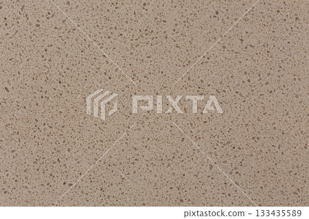 Artificial beige stone detail with vignette. Can be used as background in art or design projects. 133435589
