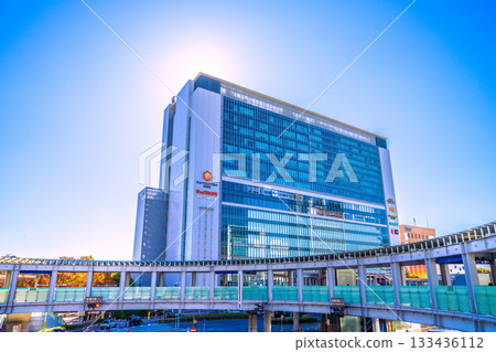 Yokohama cityscape in Japan. View of Yokohama Station, the north exit of JR Shin-Yokohama Station, and the circular footbridge over Yokohama Loop Line 2. A ray of hope. 133436112