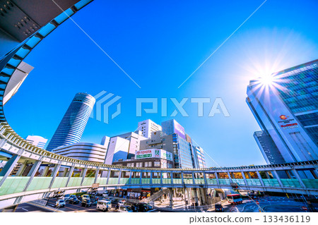 Yokohama cityscape in Japan. View of Yokohama Station, the north exit of JR Shin-Yokohama Station, and the circular footbridge over Yokohama Loop Line 2. A ray of hope. 133436119