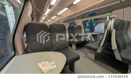 Inside of a train and tickets on the table in Antwerp Inside of a train and tickets on the table in Antwerp 133436439