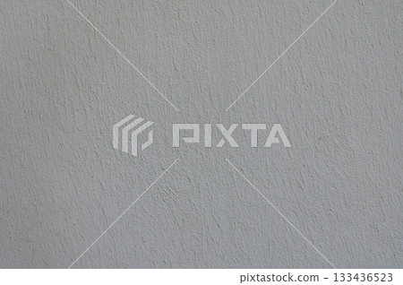Textured wall creates a subtle backdrop for creative projects and artistic expressions in indoor spaces 133436523
