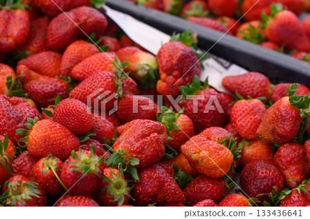 Fresh strawberries collected in a vibrant market showcasing the joys of summer harvest 133436641