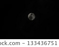 Full moon shining brightly in the cloudless night sky. 133436751