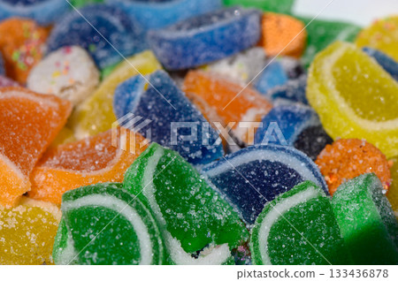 Colorful gummy candies arranged on a white surface create a visually delightful treat tempting every sweet tooth in the room Colorful gummy candies arranged on a white surface create a visually delightful treat tempting every sweet tooth in the room 133436878