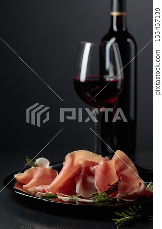 Prosciutto with rosemary and red wine. 133437139