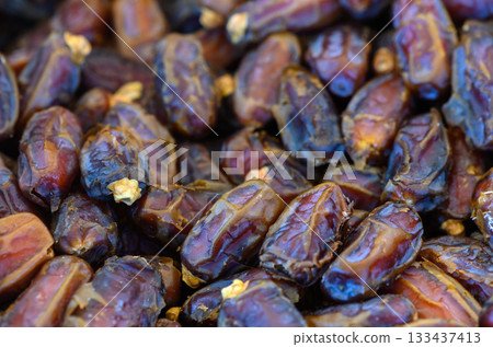 Discovering the rich textures and colors of fresh dates at a vibrant market in the heart of the desert Discovering the rich textures and colors of fresh dates at a vibrant market in the heart of the desert 133437413
