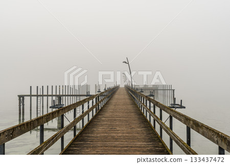 Foggy wooden pier at Hemmenhofen, Hoeri peninsula, Lake Constance, Germany 133437472