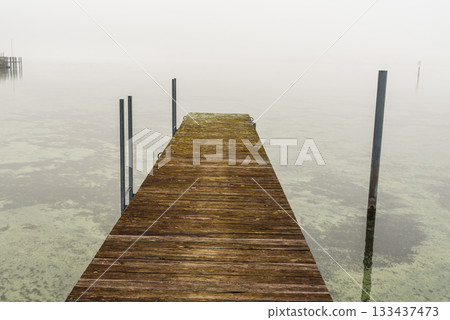 Foggy wooden jetty in Hemmenhofen, Hoeri peninsula, Lake Constance, Germany 133437473