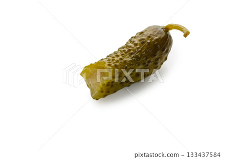 Bitten barrel-salted cucumber on white background 133437584