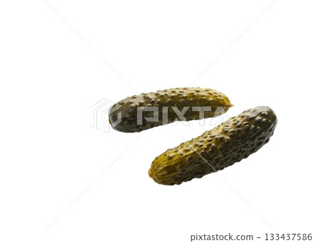 Two barrel-salted cucumbers on white background 133437586