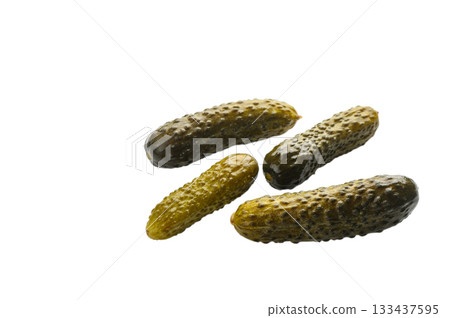 Four barrel-salted cucumbers on white background 133437595