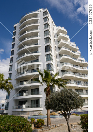 Modern architectural beauty shines under vivid blue skies at a coastal retreat, showcasing elegance and tranquility in design Modern architectural beauty shines under vivid blue skies at a coastal retreat, showcasing elegance and tranquility in design 133437636